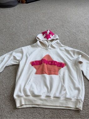 Aelfriceden Cream Hoodie with Hot Pink Star Accents and Coral Chest Panel